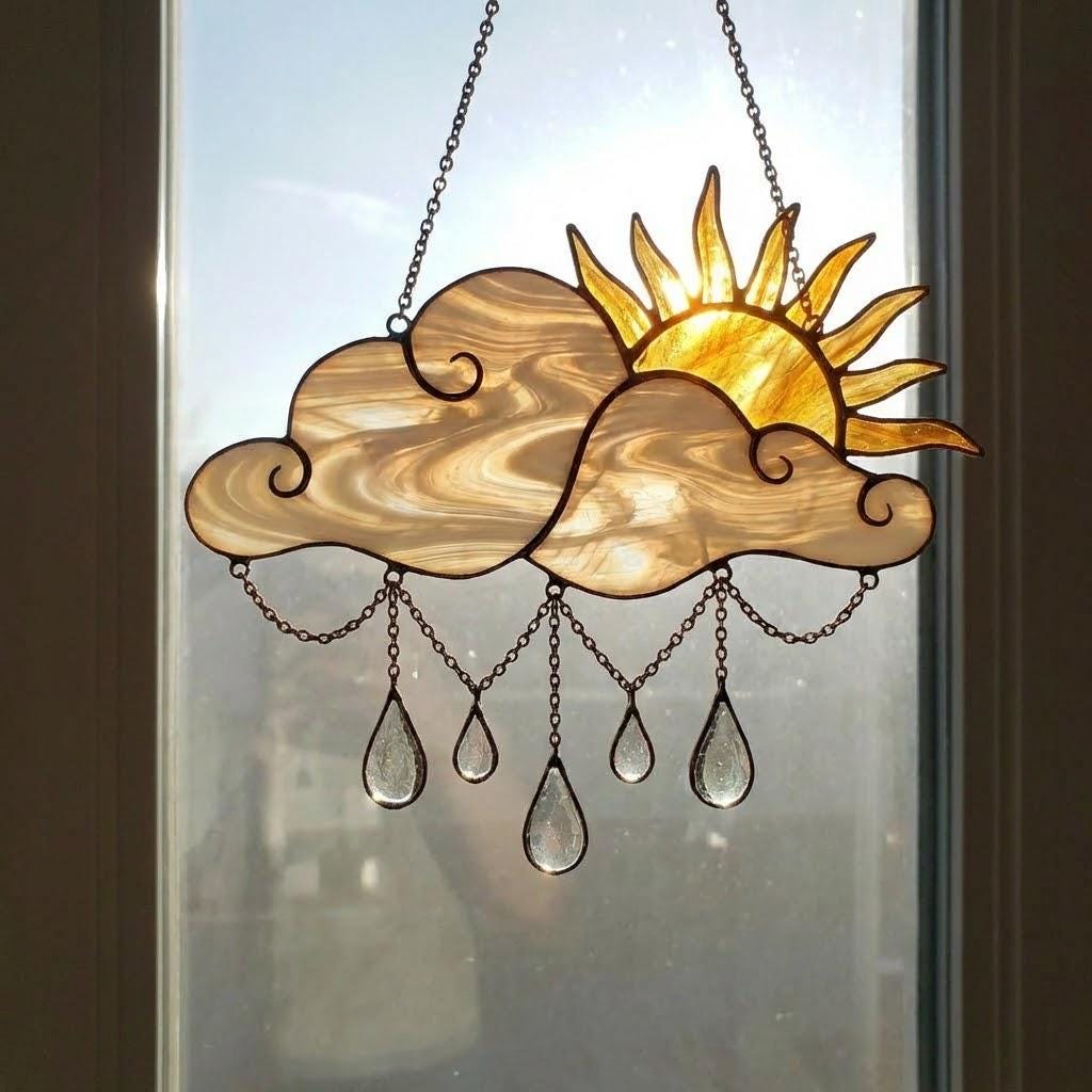 Handmade stained glass sun and cloud suncatcher with hanging crystal raindrops, wispy white glass texture, celestial nursery decor, symbol of hope.