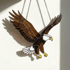 Handmade stained glass bald eagle suncatcher, realistic bird window hanging with brown and white glass, patriotic gift for dad or veteran, creating colored shadows.
