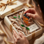 Handmade stained glass plant stakes collection including hummingbird, cardinal, blue jay birds, monarch butterfly, dragonfly, and flowers attached to metal rods for indoor plant pot decoration.