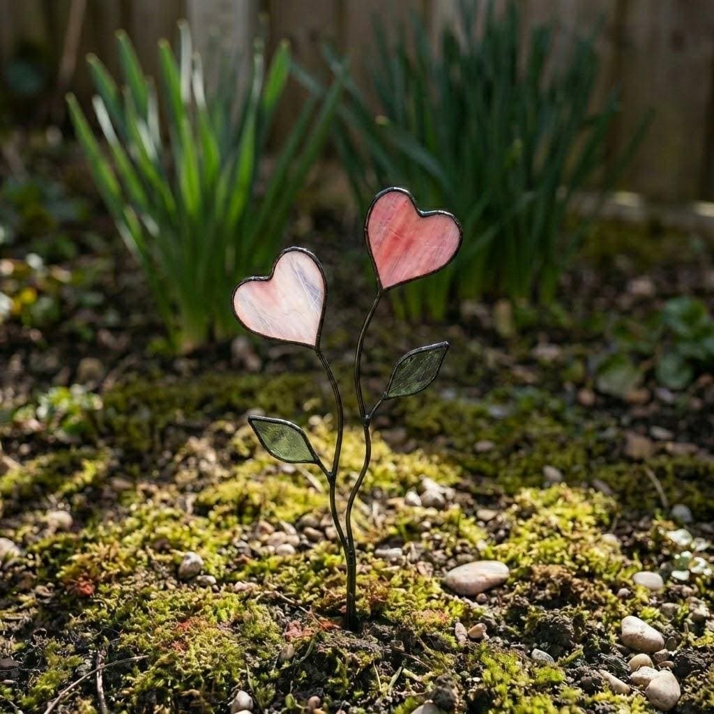 Colorful stained glass heart plant stakes with green leaves in a flower pot, gift box packaging, garden decor for plant lovers.