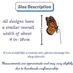 Handmade stained glass monarch butterfly plant stake with vibrant orange and black wings, suncatcher pot sitter for indoor plants, gift for butterfly lover.