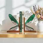 Handmade dragonfly wing stained glass bookends on premium solid oak base, green and yellow glass casting shadows, art nouveau luxury decor.