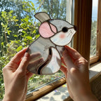 Handmade stained glass chinchilla suncatcher, cute white and grey rodent holding a branch, kawaii animal window hanging for pet lovers.