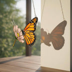 Handmade stained glass monarch butterfly perched on pink cosmos flower suncatcher, hanging window ornament, spring nature decor gift for her.