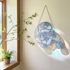 Handmade stained glass manatee suncatcher, mother and baby sea cow swimming, blue and white textured glass, ocean nursery decor, coastal window art.