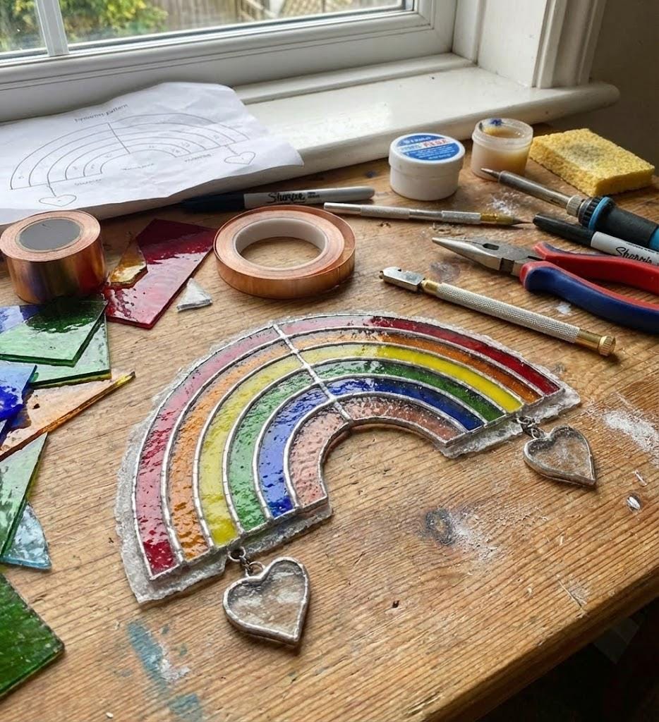 Handmade stained glass rainbow suncatcher with personalized wooden name tag, rainbow bridge pet memorial gift for dog or cat loss, hanging glass hearts.