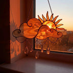 Handmade stained glass sun and cloud suncatcher with hanging crystal raindrops, wispy white glass texture, celestial nursery decor, symbol of hope.