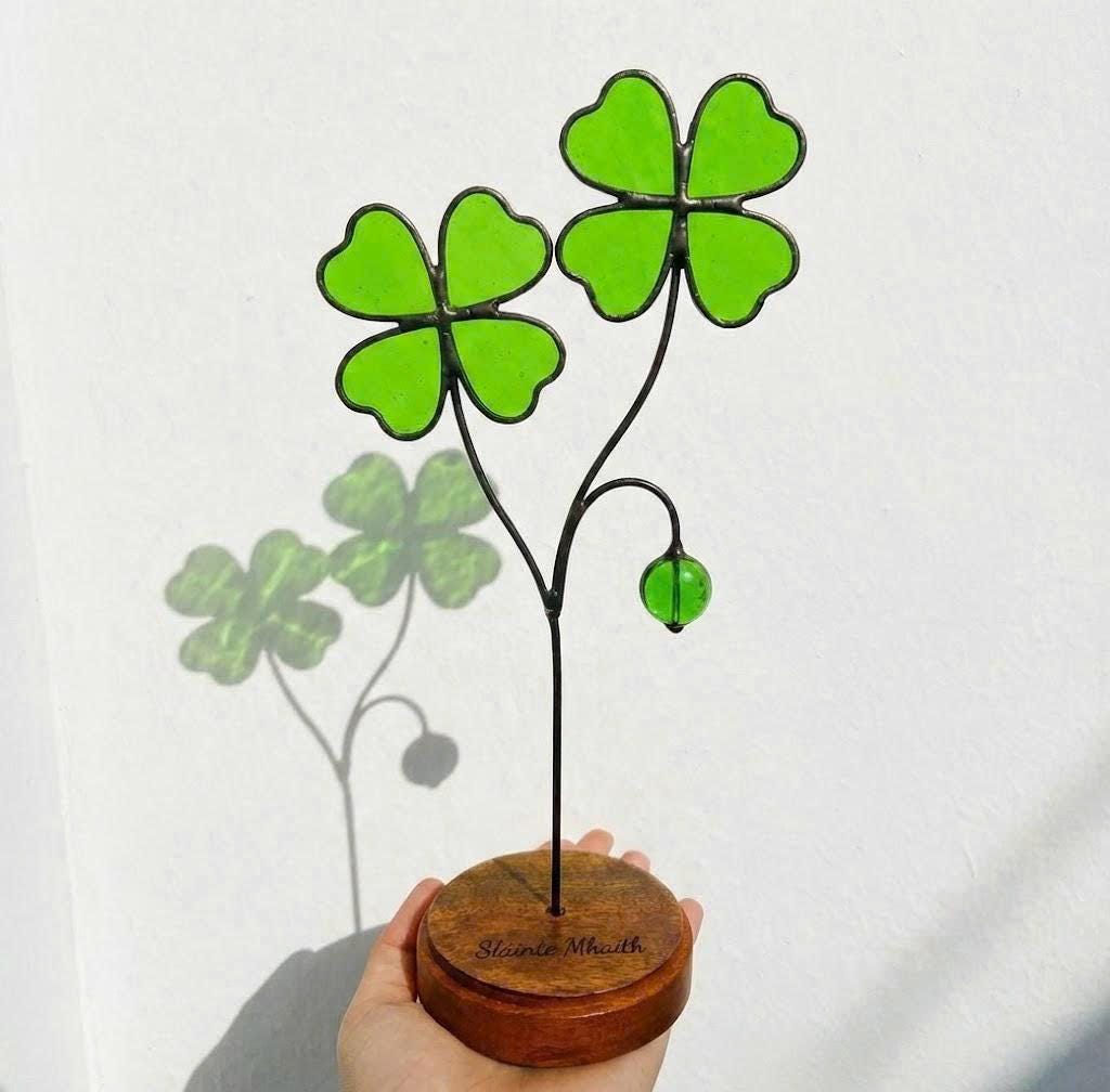 Handmade stained glass four leaf clover plant sculpture standing on wooden base, green shamrock lucky gift for desk decor, st patricks day gift.