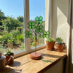 Handmade stained glass four leaf clover sculpture standing on solid wood base, green shamrock lucky gift for desk decor, feng shui plant stake.