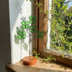 Handmade stained glass four leaf clover sculpture standing on solid wood base, green shamrock lucky gift for desk decor, feng shui plant stake.