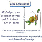 Handmade stained glass snail plant stake with amber shell and green leaves, cute cottagecore garden decor for indoor pots, gift for plant lover.