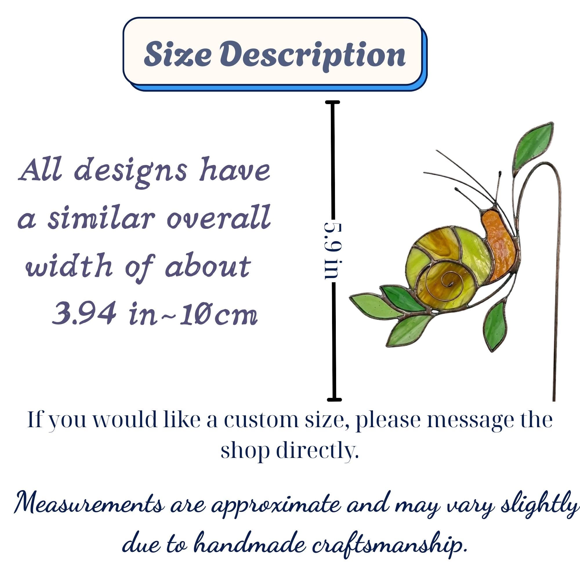 Handmade stained glass snail plant stake with amber shell and green leaves, cute cottagecore garden decor for indoor pots, gift for plant lover.
