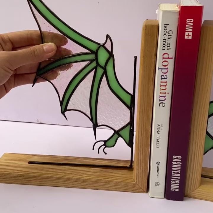 Handmade stained glass dragon wing bookends with solid oak wood base, fantasy bookshelf decor for book lovers and dark academia library