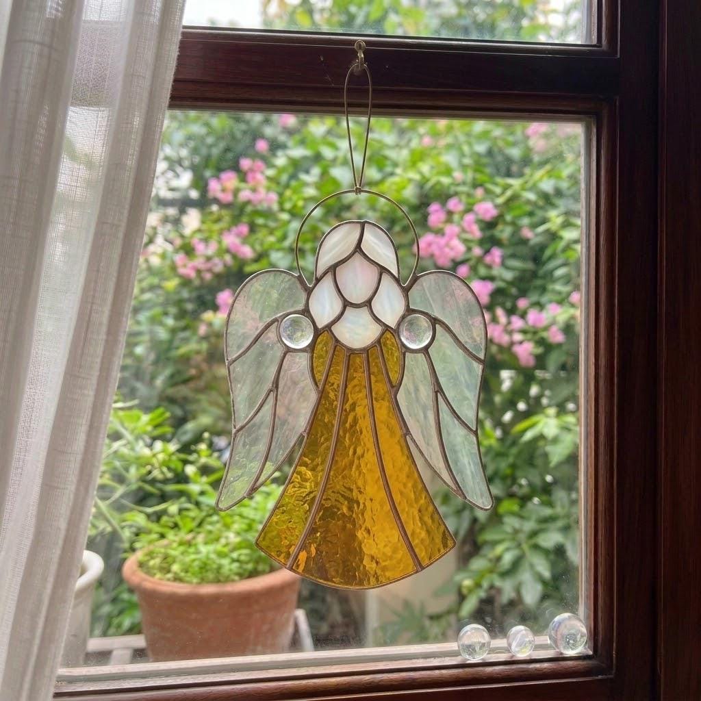 Handmade stained glass guardian angel suncatcher with amber dress and iridescent wings, premium memorial sympathy gift and christian window hanging decor.