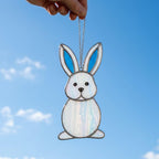 Handmade stained glass cute bunny rabbit suncatcher in iridescent pastel colors, perfect easter window decor and spring nursery room wall hanging gift.
