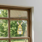 Handmade stained glass cute bunny rabbit suncatcher in iridescent pastel colors, perfect easter window decor and spring nursery room wall hanging gift.