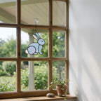 Handmade stained glass cute bunny rabbit suncatcher in iridescent pastel colors, perfect easter window decor and spring nursery room wall hanging gift.