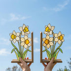 Handmade stained glass white and yellow daffodil flower bookends on premium solid wood bases, beautiful spring botanical bookshelf decor and March birth flower book lover gift.