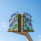 Handmade stained glass blue morning glory vine flower bookends on premium oak wood bases, beautiful september birth flower botanical shelf decor gift.