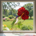 Handmade hummingbird and red hibiscus flower stained glass suncatcher casting vibrant colored shadows, perfect tropical botanical decor and memorial gift for mom.