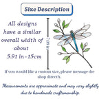 Handcrafted iridescent stained glass dragonfly suncatcher on a branch casting colored shadows, perfect memorial or Mother's Day window decor gift.