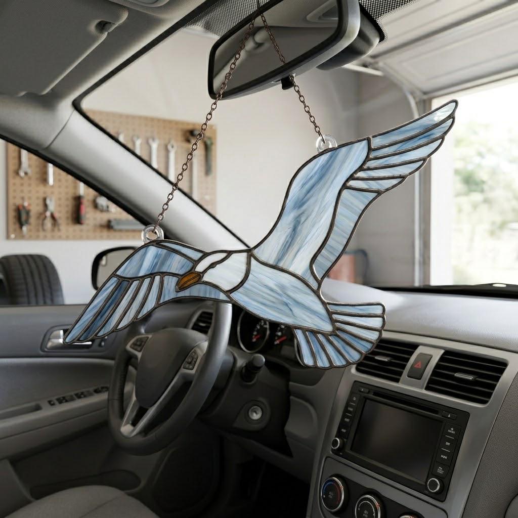 Handcrafted wispy stained glass flying seagull suncatcher casting shadows, perfect coastal beach house decor and nautical ocean lover gift.