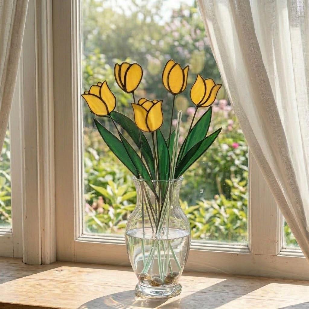 Handcrafted stained glass tulip flowers on long wire stems arranged in a sunlit vase casting colored shadows, perfect everlasting Mother's Day bouquet gift.
