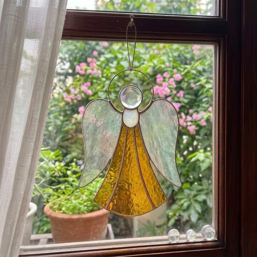 Handmade stained glass guardian angel suncatcher with amber dress and iridescent wings, premium memorial sympathy gift and christian window hanging decor.