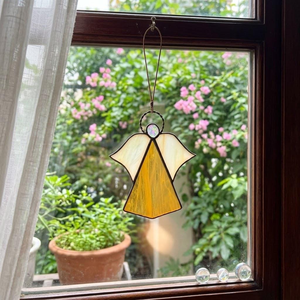 Handmade stained glass guardian angel suncatcher with amber dress and iridescent wings, premium memorial sympathy gift and christian window hanging decor.