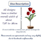 Handmade 3D red tulip stained glass flower standing on a solid walnut wood base, casting vibrant colored shadows in hard sunlight, perfect for Mother's Day gift and botanical cottagecore desk decor.