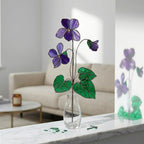 Handmade 3D purple violet stained glass flower casting vibrant colored shadows, available with a custom engraved wooden base or standalone for vase display, perfect for personalized Mother's Day gift and February birth flower desk decor.