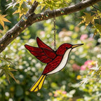 Handmade stained glass hummingbird suncatchers in colorful blue green red purple and yellow, vibrant spring window hanging and meaningful mother's day memorial gift.