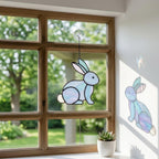 Handmade stained glass cute bunny rabbit suncatcher in iridescent pastel colors, perfect easter window decor and spring nursery room wall hanging gift.