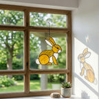 Handmade stained glass cute bunny rabbit suncatcher in iridescent pastel colors, perfect easter window decor and spring nursery room wall hanging gift.