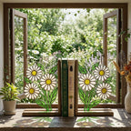 Handmade stained glass white daisy flower bookends on solid wood bases holding books on a sunlit desk, beautiful cottagecore shelf decor and book lover gift.