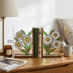 Handmade stained glass white daisy flower bookends on solid wood bases holding books on a sunlit desk, beautiful cottagecore shelf decor and book lover gift.