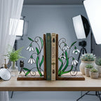 Handmade stained glass white snowdrop flower bookends with delicate wirework on solid wood bases, beautiful january birth flower spring shelf decor and book lover gift.