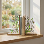 Handmade stained glass white snowdrop flower bookends with delicate wirework on solid wood bases, beautiful january birth flower spring shelf decor and book lover gift.