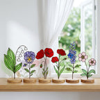 Handcrafted flat stained glass birth month flowers standing on personalized wooden bases, casting colorful light reflections. Perfect Mother's Day or birthday gift.