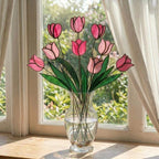 Handcrafted stained glass tulip flowers on long wire stems arranged in a sunlit vase casting colored shadows, perfect everlasting Mother's Day bouquet gift.