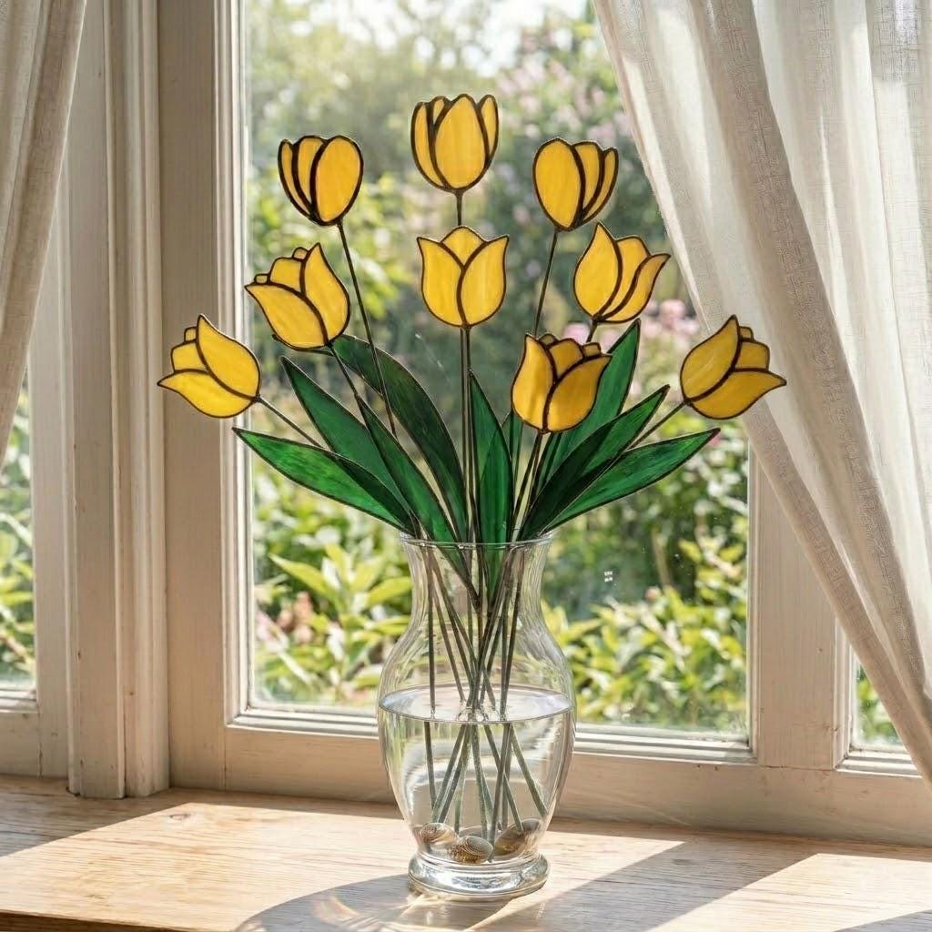 Handcrafted stained glass tulip flowers on long wire stems arranged in a sunlit vase casting colored shadows, perfect everlasting Mother's Day bouquet gift.