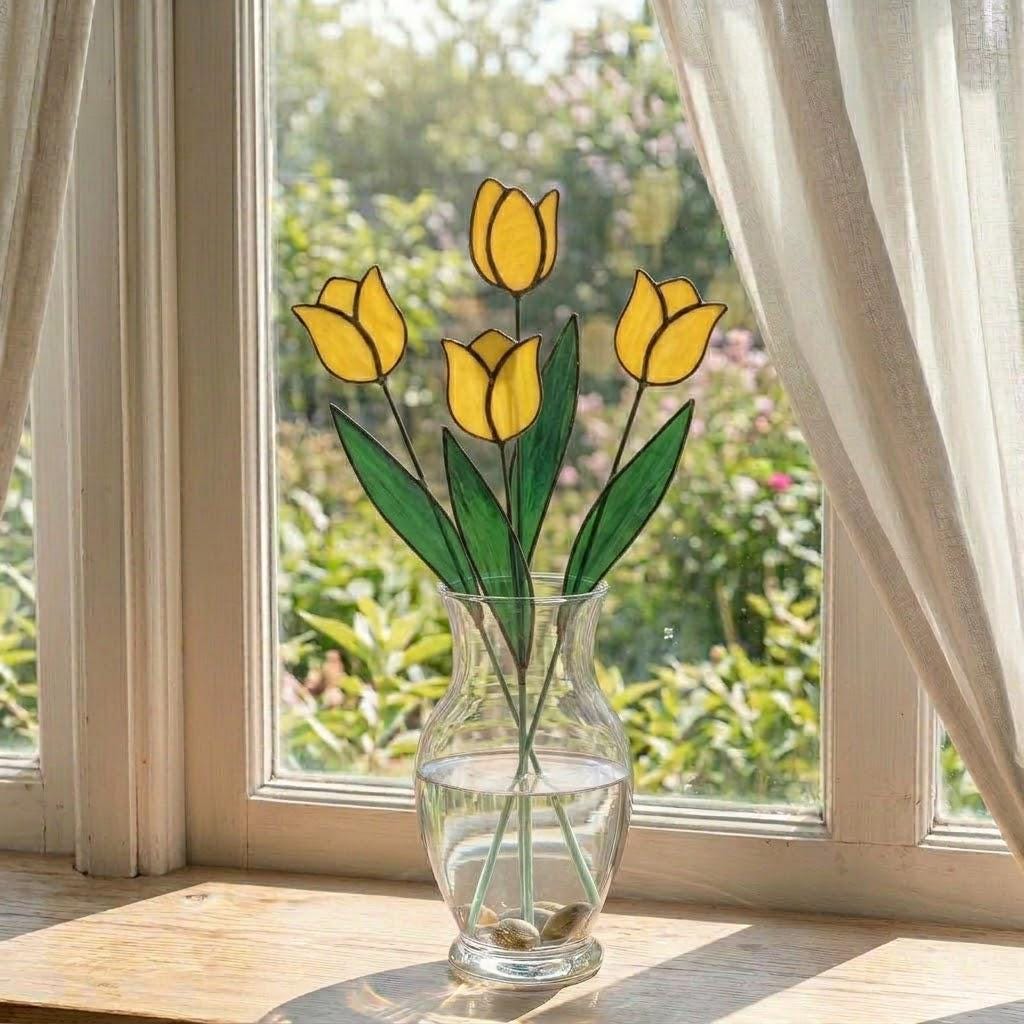 Handcrafted stained glass tulip flowers on long wire stems arranged in a sunlit vase casting colored shadows, perfect everlasting Mother's Day bouquet gift.