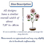 Handcrafted pink cosmos stained glass flower tree standing on a custom personalized engraved wooden base casting colored shadows, perfect October birth flower or Mother's Day desk decor gift.