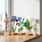 Handcrafted 2D flat stained glass birth month flower suncatcher standing on a custom engraved wooden base, perfect for office desk decor or a personalized birthday gift for women.