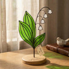 Handcrafted 2D flat stained glass birth month flower suncatcher standing on a custom engraved wooden base, perfect for office desk decor or a personalized birthday gift for women.