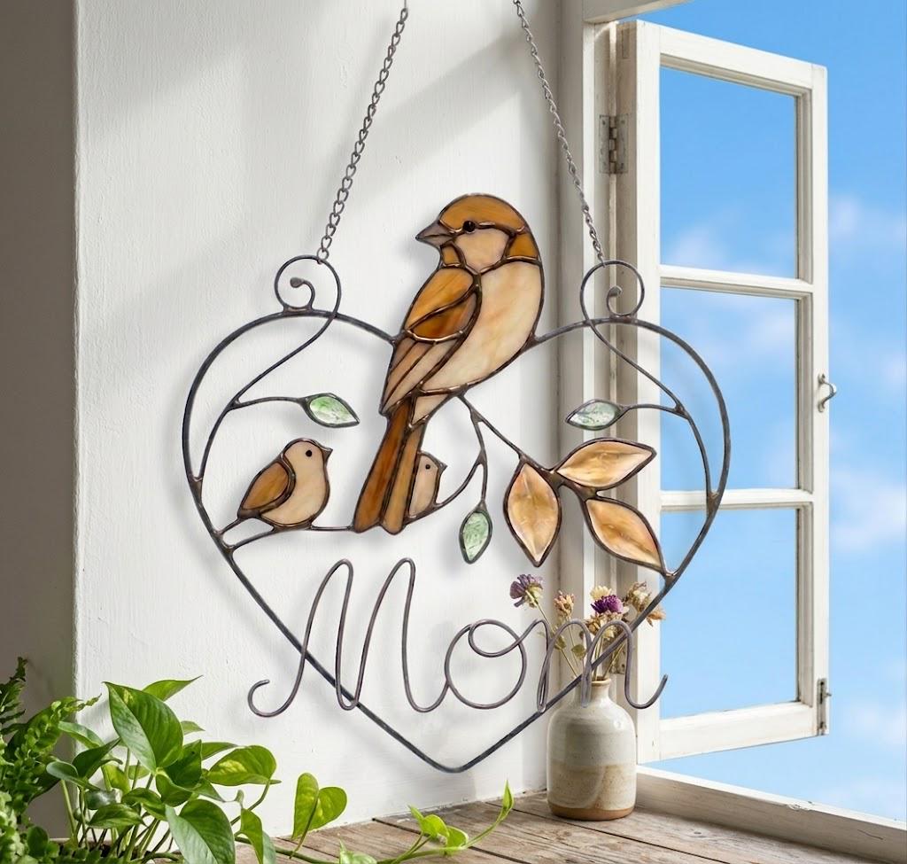 Stained glass cardinal mother and baby bird suncatcher in a heart frame with the word Mom, handmade window hanging gift.