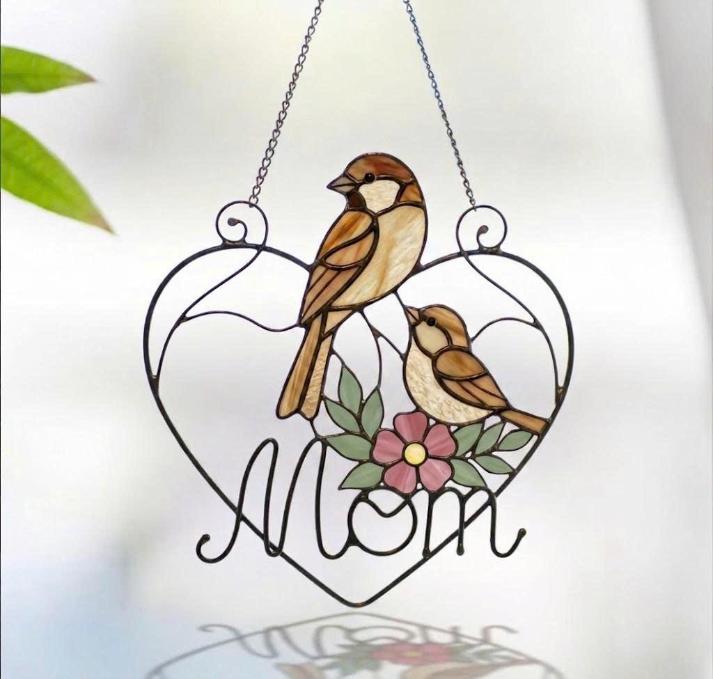 Stained glass cardinal mother and baby bird suncatcher in a heart frame with the word Mom, handmade window hanging gift.